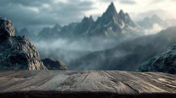 Weathered wooden table with majestic mountain landscape and misty clouds photo