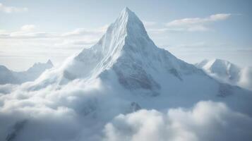 Majestic snow-covered mountain peak emerging through clouds in daylight photo