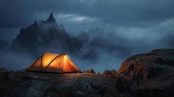 Glowing tent in a misty mountain landscape at twilight, serenity and solitude photo