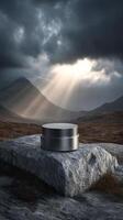 Dramatic mountain scene with metal cream jar on rock, concept of mystery object photo