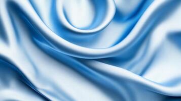 Luxurious light blue silk fabric with elegant flowing folds, abstract texture photo