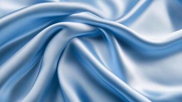 Smooth light blue silk fabric with elegant folds and a soft texture background photo