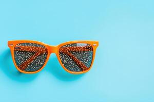 Vibrant Orange Sunglasses for a Sunny Day photo