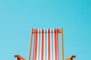 Striped Beach Chair Under Sunny Sky Perfect Summer Relaxation photo