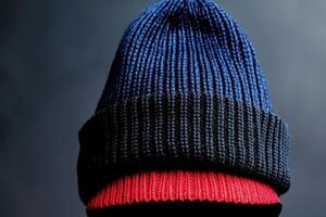 Vibrant Knitted Beanie in Blue, Black, and Red photo