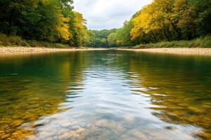 Serene Autumn River Landscape with Crystal Clear Water photo