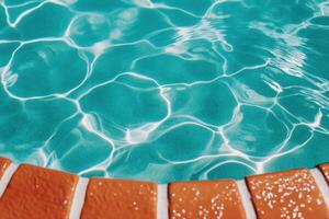 Turquoise Pool Water with Orange Tile Edge A Summer Day's Delight photo