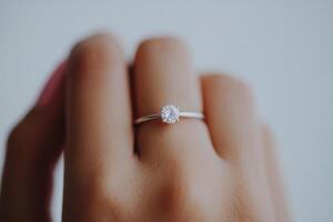 Diamond Ring on a Hand Exquisite Engagement Jewelry photo