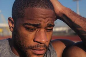 Exhausted Athlete's Portrait A Moment of Reflection photo