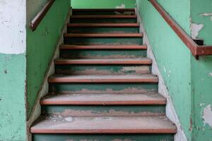 Abandoned Staircase in a Decaying Building with Peeling Paint photo