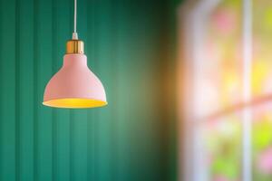 Pink Hanging Lamp in a Green Room Interior Design photo