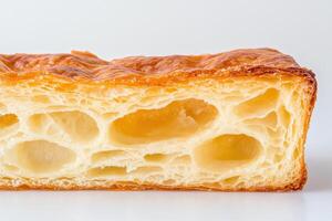 view of a flaky pastry, perfect for breakfast or dessert. A delightful treat for every occasion. photo