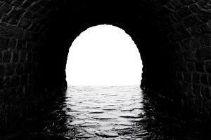 Mysterious Sea Tunnel Archway in Black and White photo