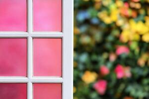 Pink Window with a Blurred Garden View photo
