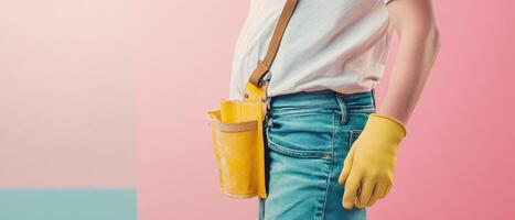 Person with yellow gloves in a workshop photo