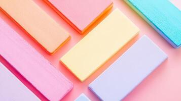 Colorful pastel foam blocks arranged on a surface photo