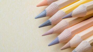 Variety of colored pencils arranged on a surface photo