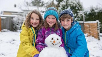 Three children proudly showing their handmade snowman creation photo