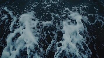 Turbulent Depths White Foam Cascading on Dark Waters Surface Abstract Ocean Scene photo