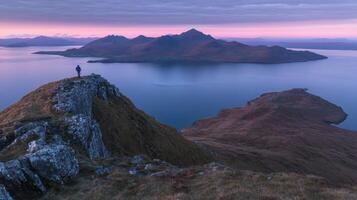 Lone Hiker on Mountain Ridge at Dusk Tranquil Landscape with Reflections and Highland Vista photo
