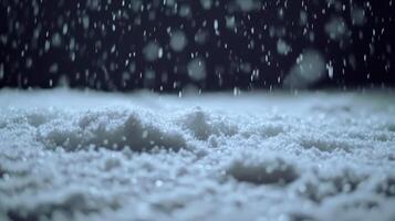 Falling snow on a dark winter night Serene cold weather scene with glittering snow crystals photo