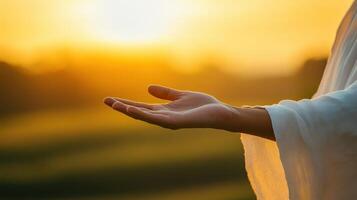 Open Hand at Sunset Offering Blessing and Spiritual Connection Golden Light photo