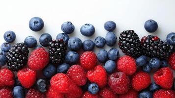 A close up of raspberries, blueberries and blackberries photo