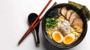 A bowl of ramen with meat and eggs photo