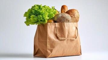 A brown paper bag filled with bread, vegetables and lettuce photo