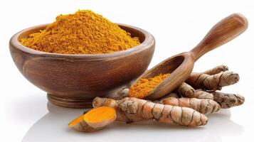 Tumeric and turmeric powder in a bowl photo