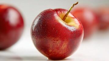 A red apple with a bite taken out of it photo