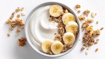 Yogurt with banana slices and granola on white background photo