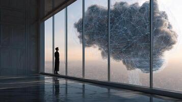 A man standing in front of a window looking out at a cloud photo