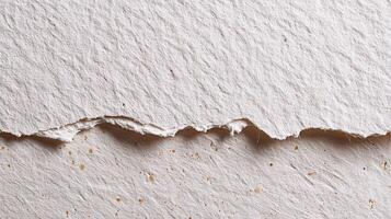 A piece of white paper with a crack in it photo