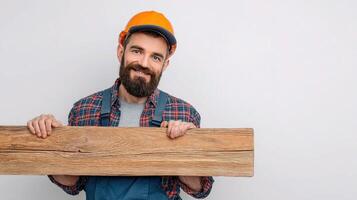 A man with a beard and hat holding a wooden plank photo