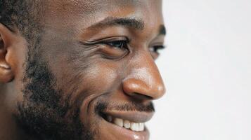 A close up of a black man smiling photo