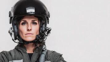 A woman in a pilot's uniform and helmet photo