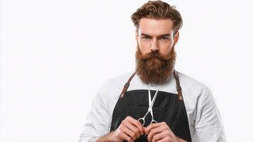 A man with a beard and apron is holding scissors photo