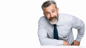 A man with a beard and tie leaning on a table photo