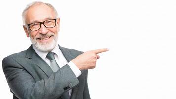An older man in a suit and tie pointing at something photo