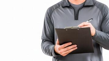 A man holding a clipboard and pen photo