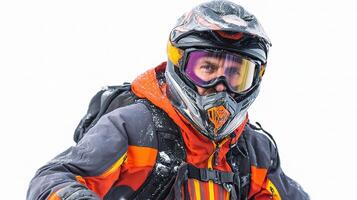 A man wearing a helmet and goggles on a snowboard photo