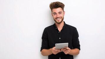 A man is holding a tablet computer and smiling photo