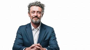 A man with a beard and a suit is sitting photo