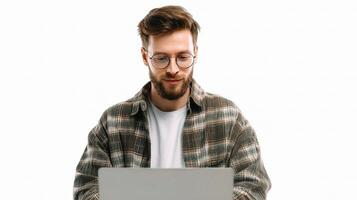 A man with glasses and a plaid shirt is using a laptop photo
