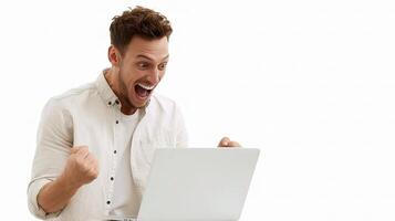 A man is excited while using a laptop photo