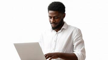 A man in a white shirt is using a laptop photo