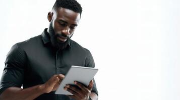 A man with a beard and black shirt is using a tablet photo
