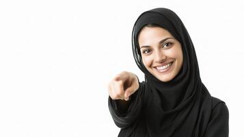 A woman in black hijab pointing at something photo