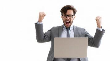 A man in a suit and glasses is holding a laptop photo
